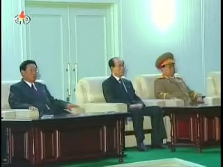 (From left to right) DPRK Premier Kim Yong-il, SPA Presidium President Kim Yong-nam and VMAR Kim Yong-chun, NDC Vice Chair and Minister of the People's Armed Forces watching the fireworks display. (Photo: KCTV)