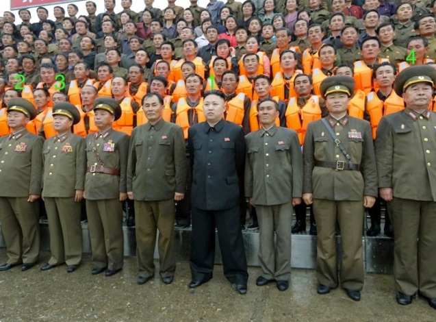 Kim Jong Un (1) poses for a commemorative photograph with managers and employees of the 25 August Fishery Station of KPA Unit #313.  Also seen in attendance is Minister of the People's Armed Forces Gen. Jang Jong Nam (2), Director of the KPA General Political Department VMar Choe Ryong Hae (3) and Chief of the KPA General Staff Gen. Kim Kyok Sik (4) (Photo: Rodong Sinmun).