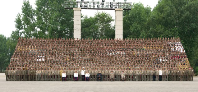 Kim Jong Un poses for a commemorative photograph with Fatherland Liberation War (Korean War) veterans and KPA commanders who participated in the anniversary military parade and demonstration held (Photo: Rodong Sinmun).