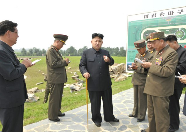 Kim Jong Un (3rd L) gestures whilst issuing instructions on the design of the Mirim Riding Club in east Pyongyang.  Also seen in attendance is Hwang Pyong So (L), Deputy Director of the KWP Organization Guidance Department (Photo: Rodong Sinmun).