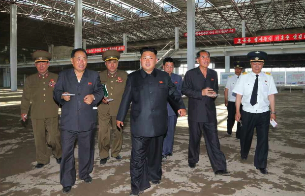 Kim Jong Un tours the construction of Terminal #2 at Pyongyang Airport.  Also seen in attendance are VMar Hwang Pyong So (1st left), Ma Won Chun (3rd left) and Director of the DPRK General Bureau of Civil Aviation Kang Ki Sop (2nd right) (Photo: Rodong Sinmun).