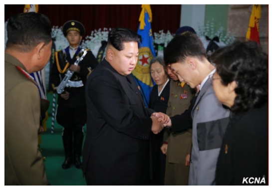 Kim Jong Un greets members of MAR Ri Ul Sol's family after paying his respects to Ri (Photo: KCNA).
