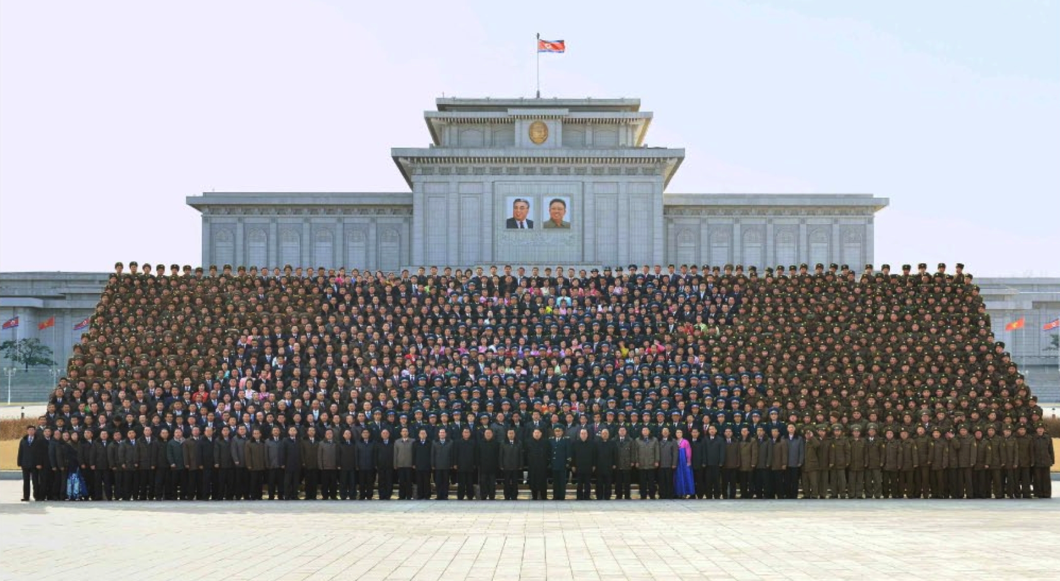 Kim Jong Un and personnel involved in the Kwangmyo'ngso'ng-4 rocket launch pose for a commemorative photo outside Ku'msusan Memorial Palace of the Sun in Pyongyang on February 17, 2016 (Photo: Rodong Sinmun).