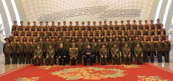 Kim Jong Un poses for a commemorative photograph with musicians and other personnel of the KPA Military Band, after a concert marking its 70th anniversary (Photo: Rodong Sinmun).