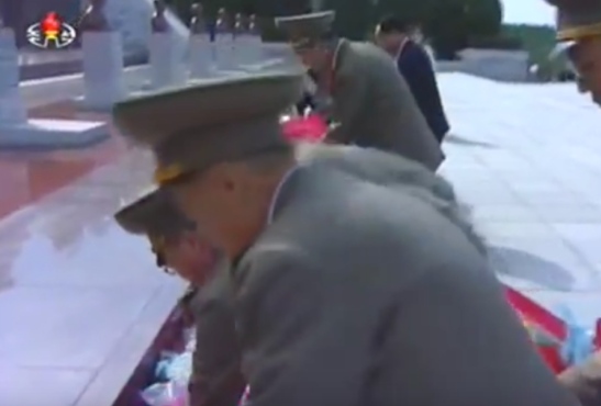 7th Party Congress participants place floral bouquets in front of the memorial bust of Kim Jong Suk at Revolutionary Martyrs' Cemetery on May 4, 2016 (Photo: Korean Central TV).