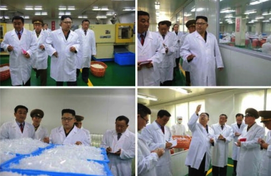 Kim Jong Un tours and inspects products of the Taedonggang Syringe Factory in photos which appeared on the bottom left of the front page of the September 24, 2016 edition of the WPK daily organ Rodong Sinmun (Photos: Rodong Sinmun/KCNA).