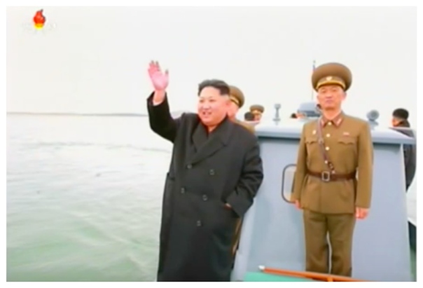 Kim Jong Un waves to KPA service members while department Mahap Islet. Also in attendance, right is IV Army Corps Commander Lt. Gen. Ri So'ng-kuk (Photo: Korean Central Television).